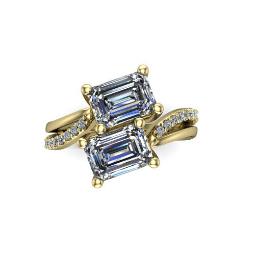 Julieta emerald three stone engagement ring in 14K Yellow Gold, top-down view showing two step-cut emerald diamonds set diagonally in a toi et moi bypass arrangement