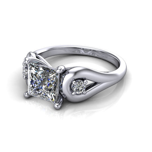 Imani princess three stone engagement ring in 14K White Gold, three-quarter perspective showing the brilliant princess-cut center diamond flanked by two round side diamonds in square frames on bypass loop shoulders