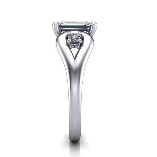 Imani emerald three stone engagement ring in 14K White Gold, side profile showing the bypass loop shoulders curving through the square side frames and slim polished band