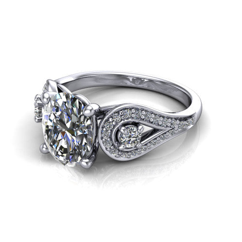 Jennifer oval three stone engagement ring in 18K White Gold, three-quarter perspective showing the brilliant oval center diamond flanked by two round side diamonds in pave teardrop frames on a pave split shank