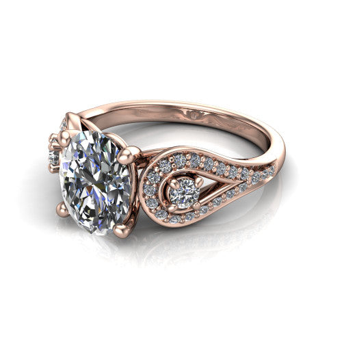 Jennifer oval three stone engagement ring in 14K Rose Gold, three-quarter perspective showing the brilliant oval center diamond flanked by two round side diamonds in pave teardrop frames on a pave split shank