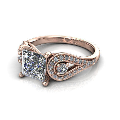 Jennifer princess three stone engagement ring in 14K Rose Gold, three-quarter perspective showing the brilliant princess-cut center diamond flanked by two round side diamonds in pave teardrop frames on a pave split shank