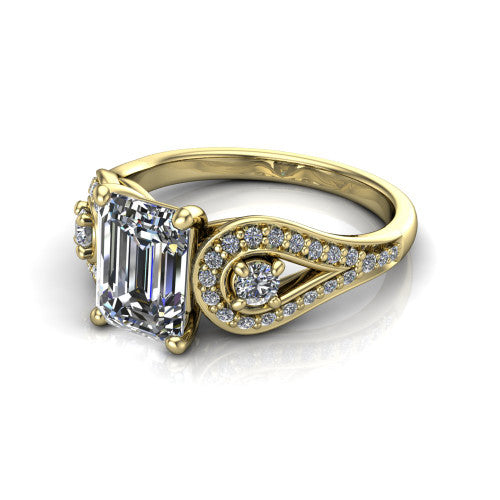 Jennifer emerald three stone engagement ring in 14K Yellow Gold, three-quarter perspective showing the step-cut emerald center diamond flanked by two round side diamonds in pave teardrop frames on a pave split shank