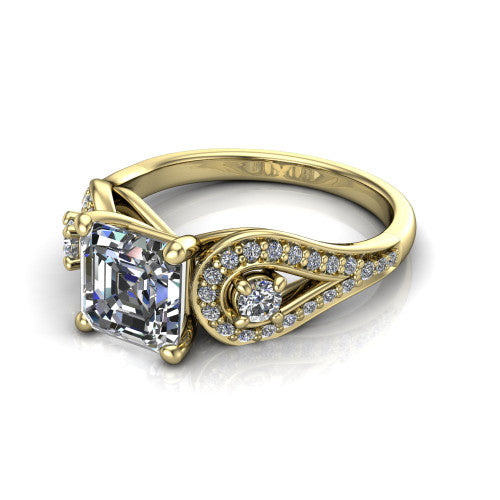 Jennifer square emerald three stone engagement ring in 18K Yellow Gold, three-quarter perspective showing the step-cut square emerald center diamond flanked by two round side diamonds in pave teardrop frames on a pave split shank
