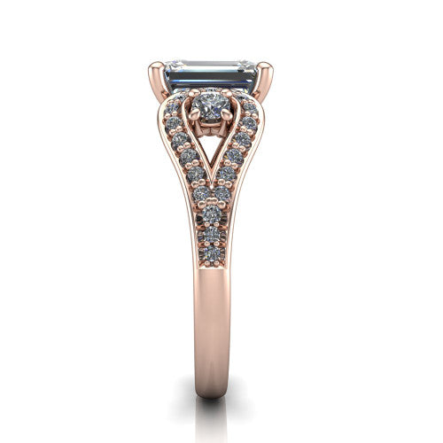 Jennifer emerald three stone engagement ring in 18K Rose Gold, side profile showing the pave teardrop side frame, cathedral lift, and pave split shank