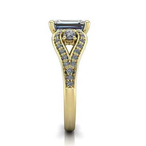 Jennifer emerald three stone engagement ring in 18K Yellow Gold, side profile showing the pave teardrop side frame, cathedral lift, and pave split shank