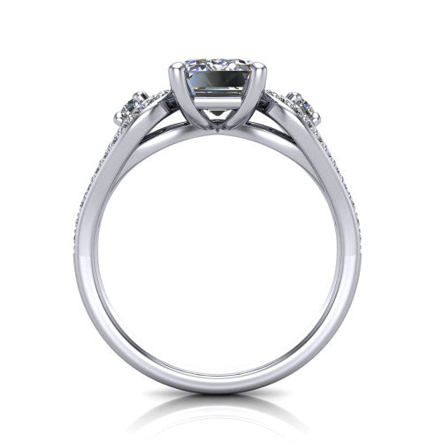 Jennifer emerald three stone engagement ring in Platinum, through-finger front profile showing the three-stone head, pave teardrop side frames, and open under-gallery