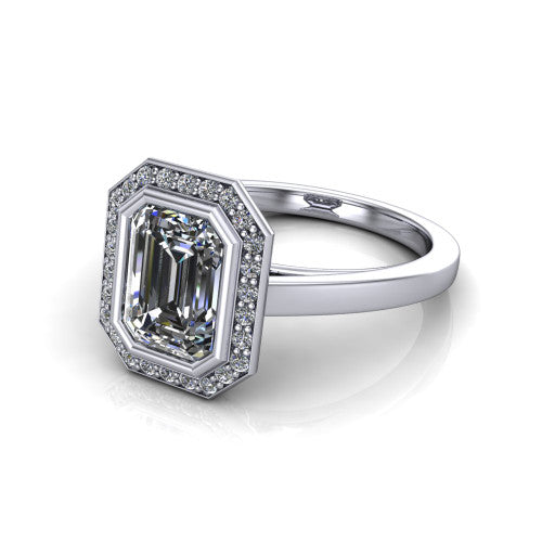 Rosie emerald halo bezel-set engagement ring in 14K White Gold — three-quarter perspective showing the emerald-cut center diamond, pavé diamond halo, and slim high-polish shank