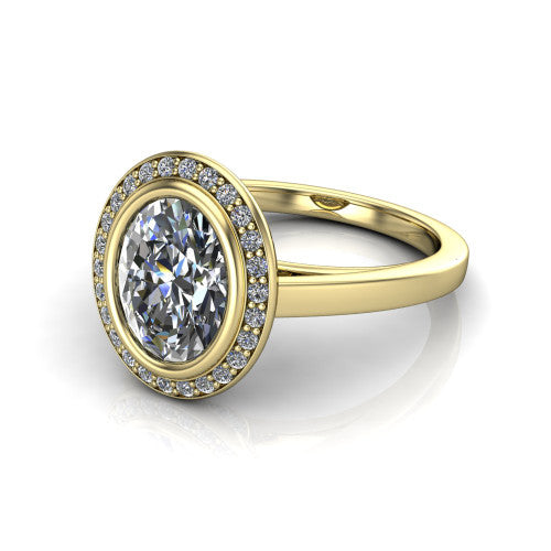 Rosie oval halo bezel-set engagement ring in 18K Yellow Gold — three-quarter perspective showing the oval-cut center diamond, pavé diamond halo, and slim high-polish shank