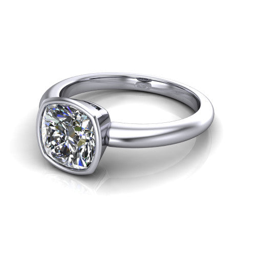 Lauren cushion bezel solitaire engagement ring in Platinum, three-quarter perspective showing the bezel-set cushion center diamond on a polished band