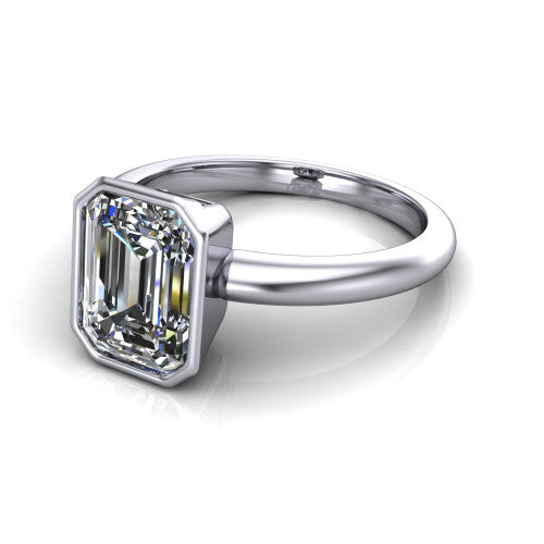Lauren emerald bezel solitaire engagement ring in 18K White Gold, three-quarter perspective showing the bezel-set emerald center diamond on a polished band