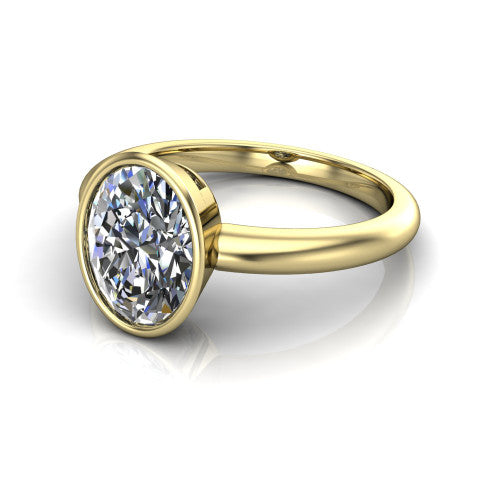 Lauren oval bezel solitaire engagement ring in 18K Yellow Gold, three-quarter perspective showing the bezel-set oval center diamond on a polished band