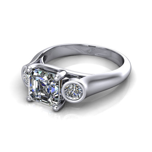 Rory square emerald three stone engagement ring in 14K White Gold, three-quarter perspective showing the square emerald center diamond between two bezel-set round side stones