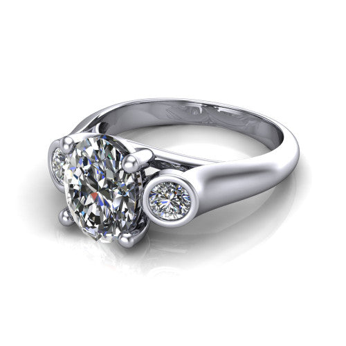 Rory oval three stone engagement ring in 14K White Gold, three-quarter perspective showing the oval center diamond between two bezel-set round side stones