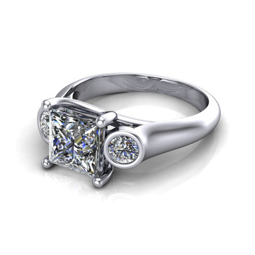 Rory princess three stone engagement ring in 18K White Gold, three-quarter perspective showing the princess center diamond between two bezel-set round side stones