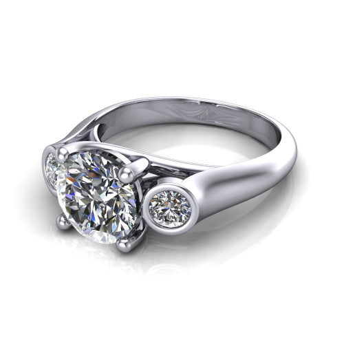 Rory round three stone engagement ring in Platinum, three-quarter perspective showing the round center diamond between two bezel-set round side stones