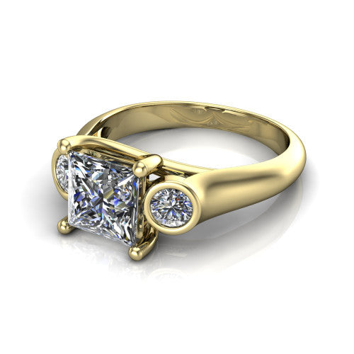 Rory princess three stone engagement ring in 14K Yellow Gold, three-quarter perspective showing the princess center diamond between two bezel-set round side stones