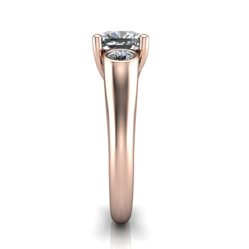 Rory cushion three stone engagement ring in 18K Rose Gold, side profile showing the bezel side stones and polished band