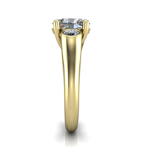 Rory oval three stone engagement ring in 14K Yellow Gold, side profile showing the bezel side stones and polished band