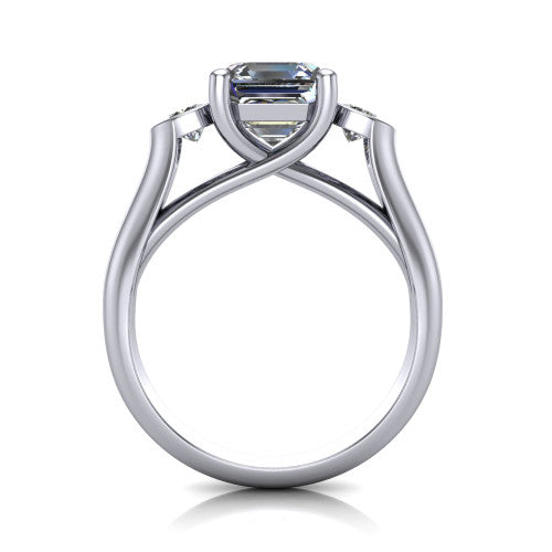 Rory square emerald three stone engagement ring in Platinum, through-finger front profile showing the open split basket and polished band