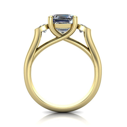 Rory square emerald three stone engagement ring in 14K Yellow Gold, through-finger front profile showing the open split basket and polished band