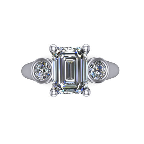 Rory emerald three stone engagement ring in 18K White Gold, top-down view showing the emerald center diamond and bezel-set round accents