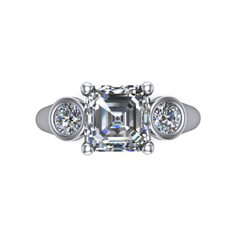 Rory square emerald three stone engagement ring in 18K White Gold, top-down view showing the square emerald center diamond and bezel-set round accents