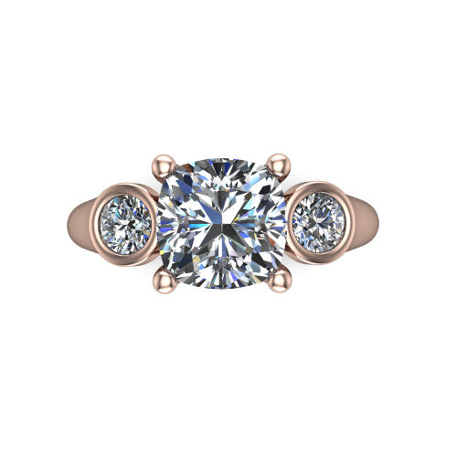 Rory cushion three stone engagement ring in 14K Rose Gold, top-down view showing the cushion center diamond and bezel-set round accents
