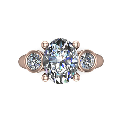 Rory oval three stone engagement ring in 18K Rose Gold, top-down view showing the oval center diamond and bezel-set round accents
