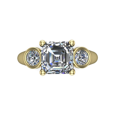 Rory square emerald three stone engagement ring in 18K Yellow Gold, top-down view showing the square emerald center diamond and bezel-set round accents