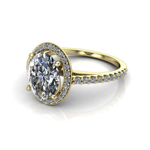Oaklyn oval halo engagement ring in 18K Yellow Gold, three-quarter perspective showing the brilliant oval center diamond inside a pave halo on pave-set shoulders rising into a cathedral basket