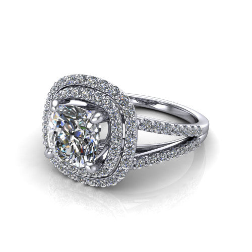 Brynn cushion double halo engagement ring in Platinum, three-quarter perspective showing the cushion center diamond in a double pave halo above a split-shank band