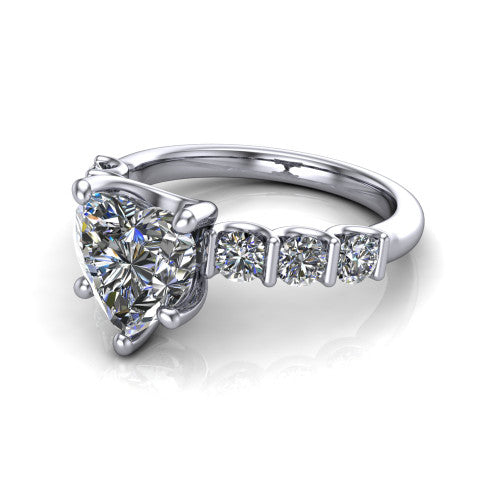 Liora heart solitaire engagement ring in Platinum, three-quarter perspective showing the heart center diamond with graduated round side accents on a polished band