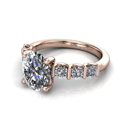 Liora oval solitaire engagement ring in 18K Rose Gold, three-quarter perspective showing the oval center diamond with graduated round side accents on a polished band