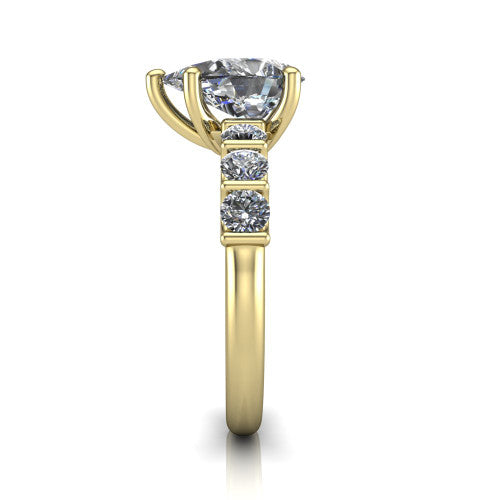 Liora pear solitaire engagement ring in 14K Yellow Gold, side profile showing the side accents and polished band