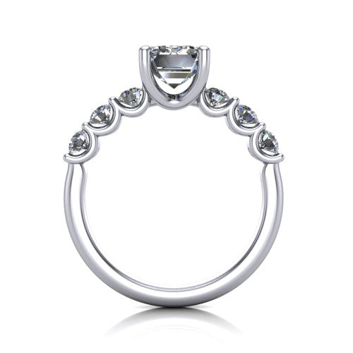 Liora emerald solitaire engagement ring in 18K White Gold, through-finger front profile showing the graduated side stones and open basket