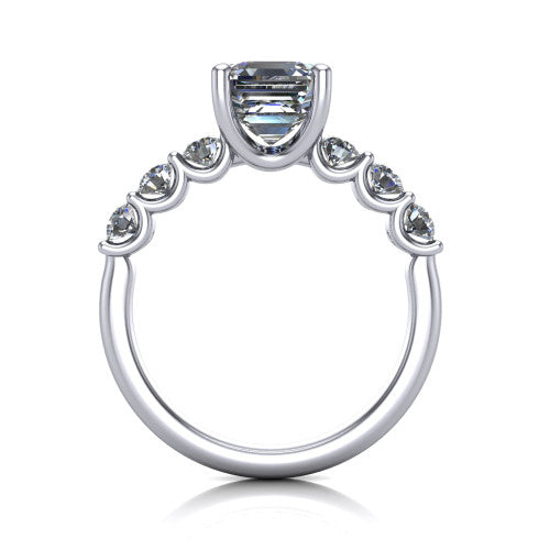 Liora square emerald solitaire engagement ring in Platinum, through-finger front profile showing the graduated side stones and open basket