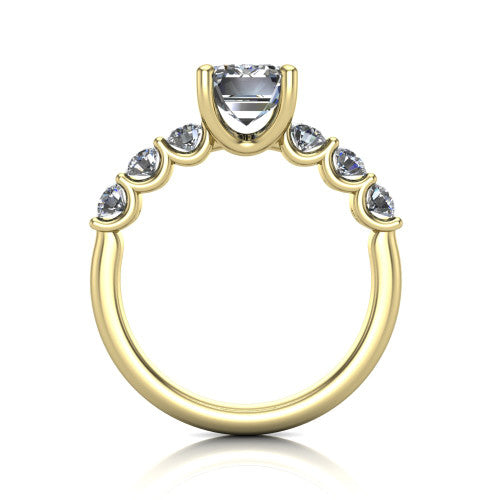 Liora emerald solitaire engagement ring in 18K Yellow Gold, through-finger front profile showing the graduated side stones and open basket