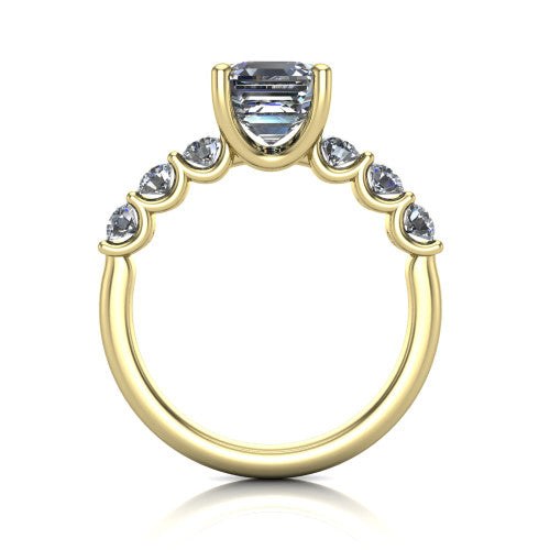 Liora square emerald solitaire engagement ring in 18K Yellow Gold, through-finger front profile showing the graduated side stones and open basket