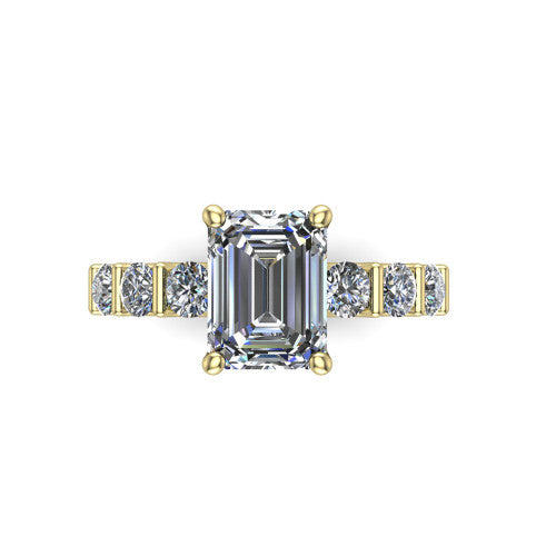 Liora emerald solitaire engagement ring in 14K Yellow Gold, top-down view showing the emerald center diamond and bar-set side accents