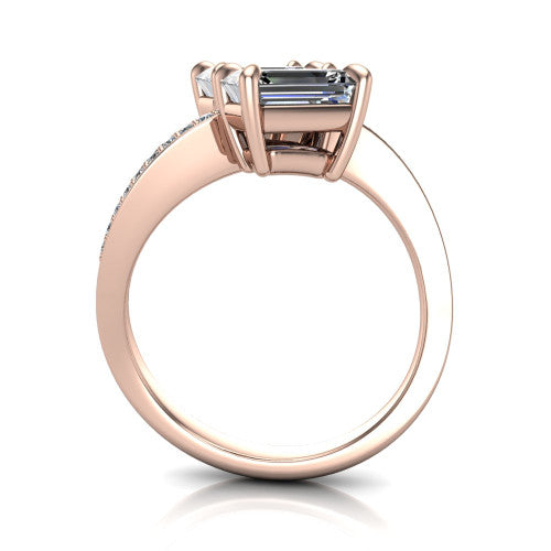 Elowen emerald two stone engagement ring in 18K Rose Gold, through-finger front profile showing the pave bypass band