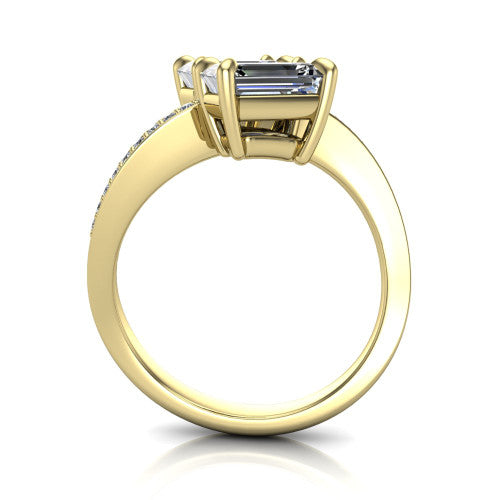 Elowen emerald two stone engagement ring in 18K Yellow Gold, through-finger front profile showing the pave bypass band