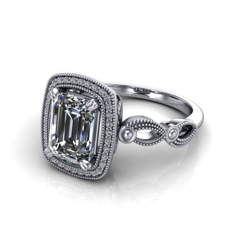 Phoenix emerald-cut vintage halo engagement ring in 18K White Gold, three-quarter perspective showing the emerald-cut center diamond, vintage cushion halo, and infinity-twist band