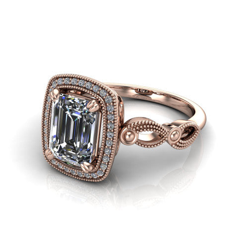 Phoenix emerald-cut vintage halo engagement ring in 14K Rose Gold, three-quarter perspective showing the emerald-cut center diamond, vintage cushion halo, and infinity-twist band