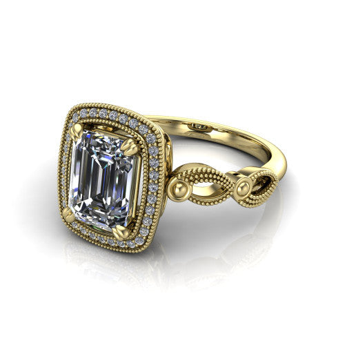Phoenix emerald-cut vintage halo engagement ring in 14K Yellow Gold, three-quarter perspective showing the emerald-cut center diamond, vintage cushion halo, and infinity-twist band