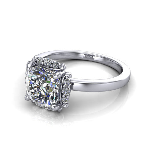 Mckenna cushion-cut halo engagement ring in Platinum, three-quarter perspective showing the cushion-cut center diamond, diamond halo, and polished band