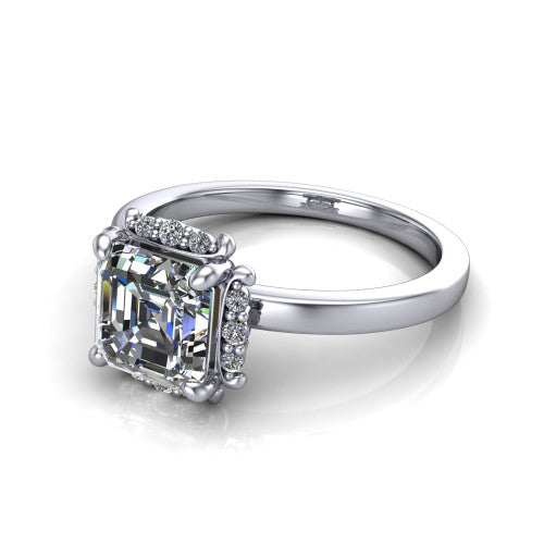 Mckenna square emerald-cut halo engagement ring in Platinum, three-quarter perspective showing the square emerald-cut center diamond, diamond halo, and polished band