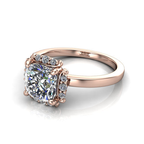 Mckenna cushion-cut halo engagement ring in 14K Rose Gold, three-quarter perspective showing the cushion-cut center diamond, diamond halo, and polished band