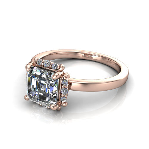 Mckenna square emerald-cut halo engagement ring in 18K Rose Gold, three-quarter perspective showing the square emerald-cut center diamond, diamond halo, and polished band