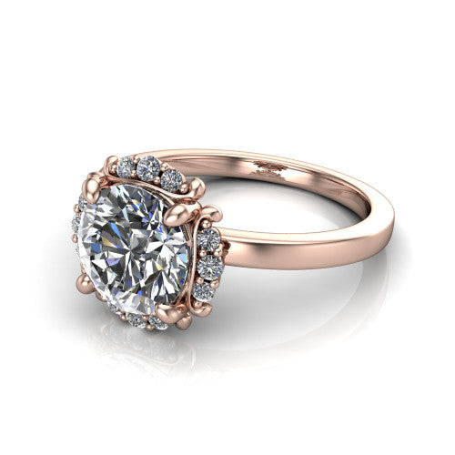 Mckenna round halo engagement ring in 18K Rose Gold, three-quarter perspective showing the round center diamond, diamond halo, and polished band